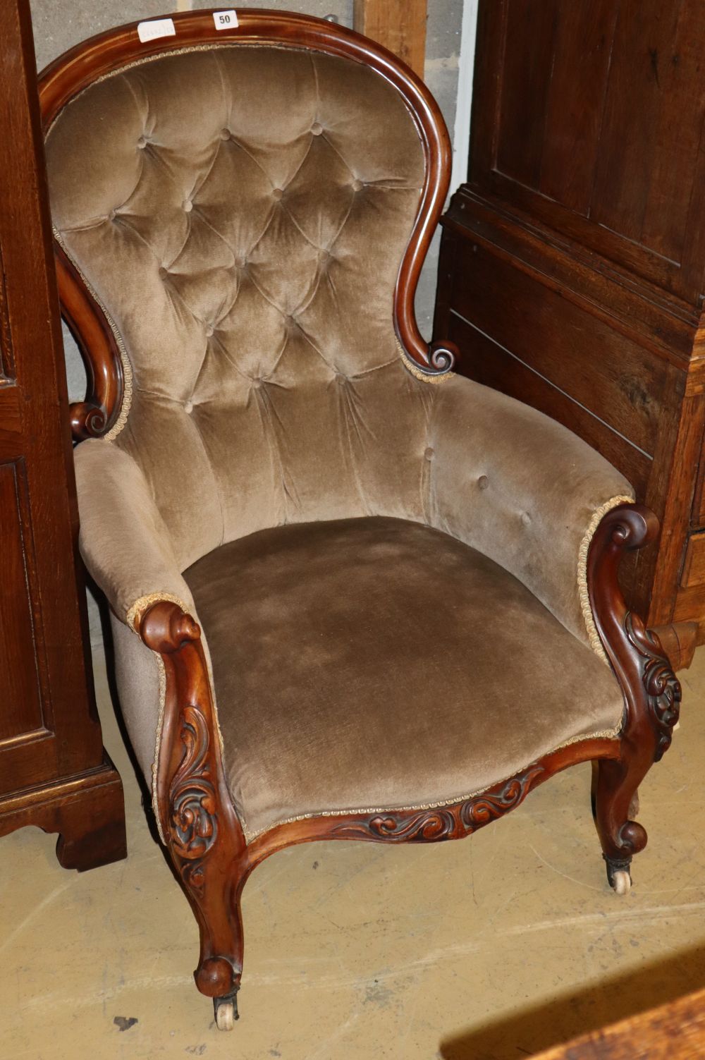 A Victorian mahogany button back armchair